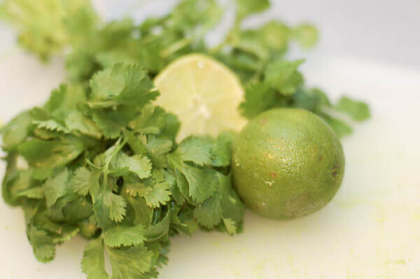 Limes and cilantro for sweet corn guacamole