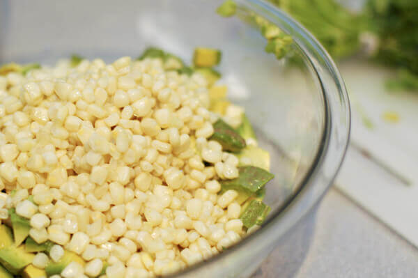 bowl of sweet corn and diced avocado