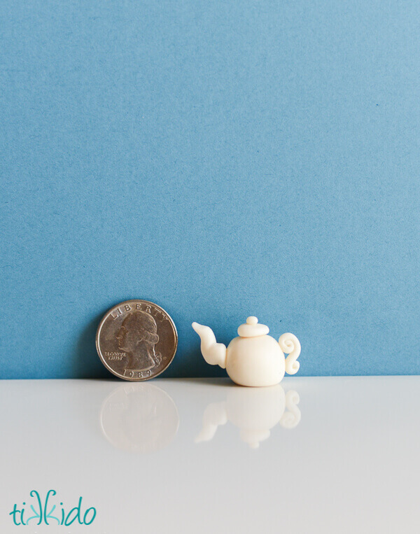 Gum Paste Tea Pot next to a quarter for scale.