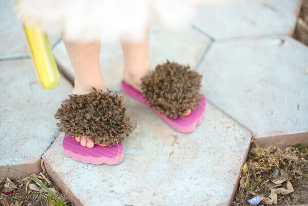 Little girl wearing hobbit feet flip flops at the hobbit birthday party.