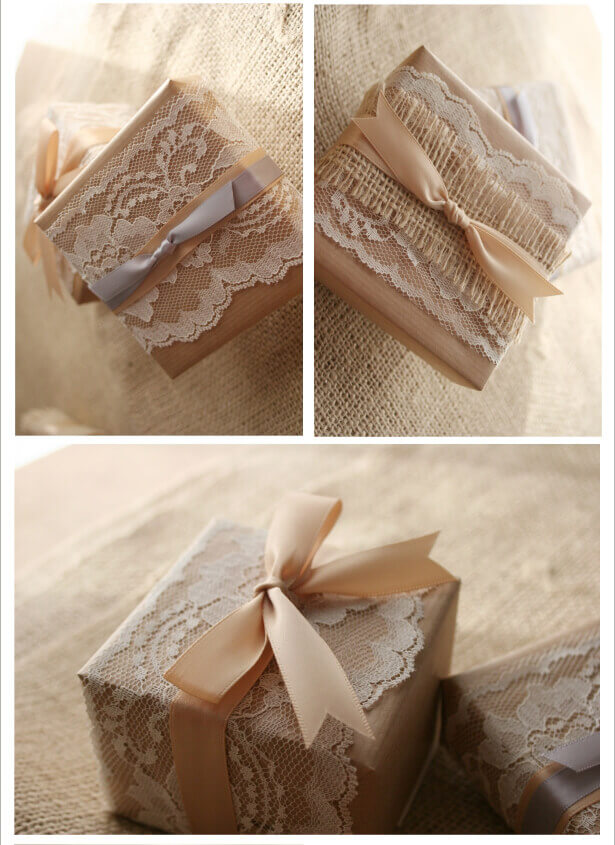 Plain brown kraft box wrapped in white lace, burlap, and ribbon.
