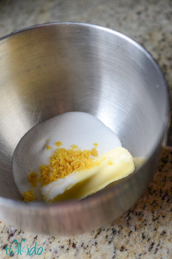 Kitchenaid mixing bowl with butter, lemon zest, and sugar, for making Lemon Loaf Cake.