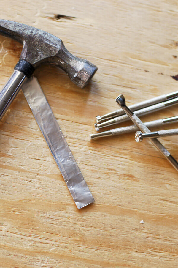 Materials for making Mexican punched tin napkin rings.