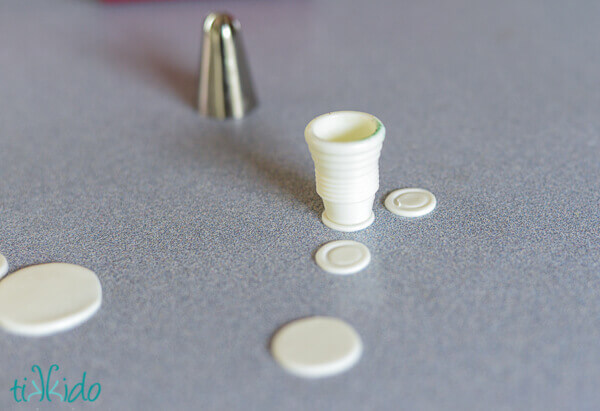 Miniature gum paste plates being made for tea party cupcakes.