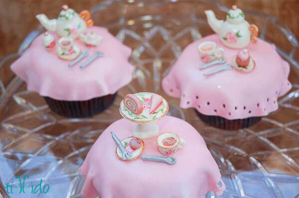 Tea party cupcakes featuring miniature gum paste tea sets.