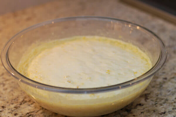 Ingredients for sweet corn tomalito mixed in a microwave safe pyrex bowl