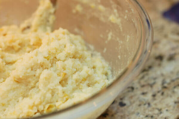 Cooked microwave sweet corn tomalito corn pudding in a pyrex bowl.