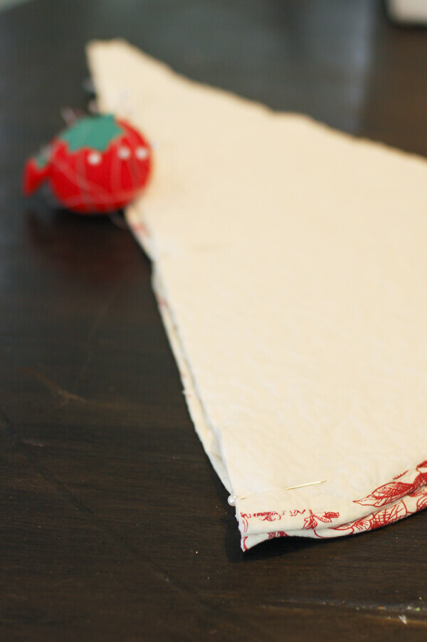 Pieces of a Quilted Christmas Tree Skirt being pinned together.