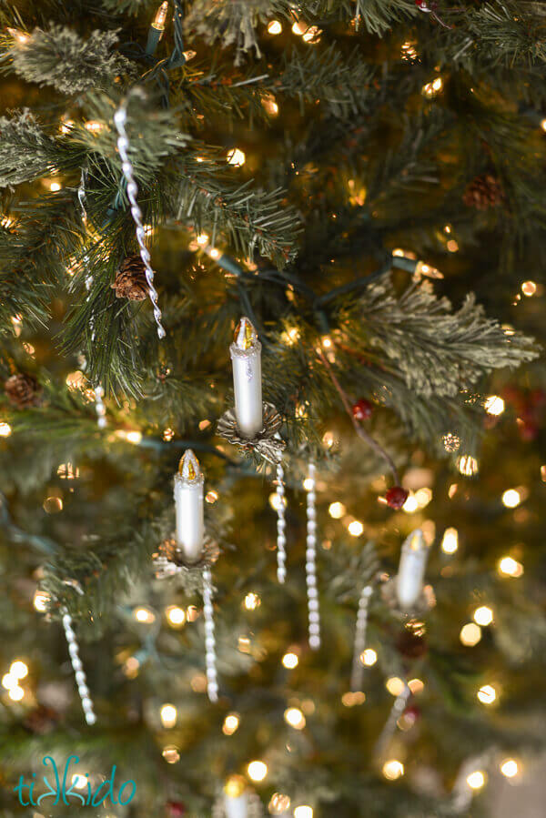 DIY tinsel Victorian Christmas decorations hung on a Christmas tree.