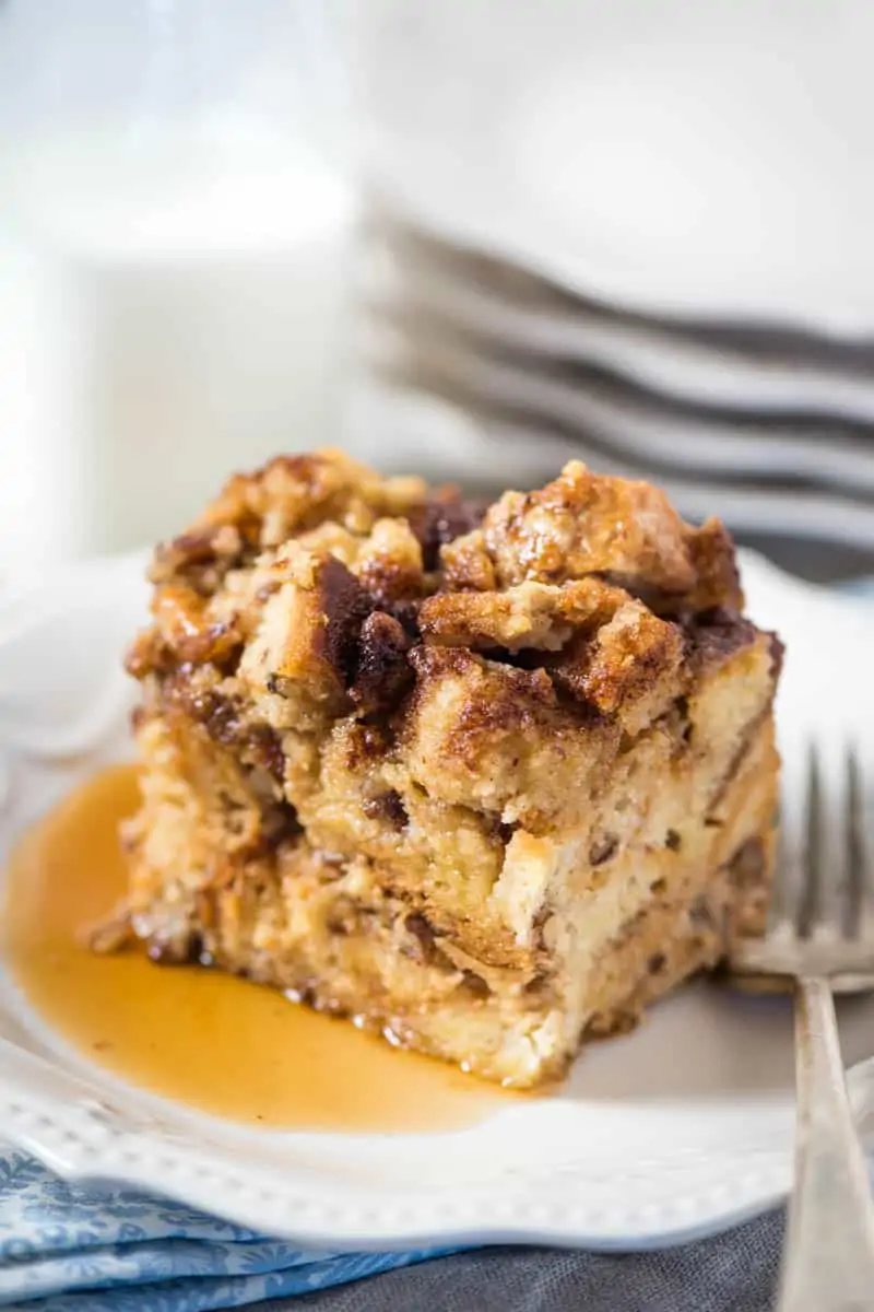 Serving of slow cooker french toast casserole on a white plate.