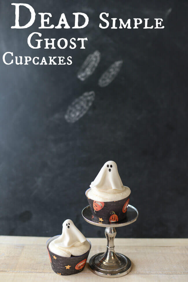 Two Halloween cupcakes topped with gum paste ghost cupcake toppers, with text overlay reading "Dead simple ghost cupcakes."