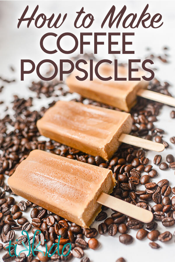 Three coffee popsicles on a bed of whole coffee beans, with text overlay reading "How to Make Coffee Popsicles."