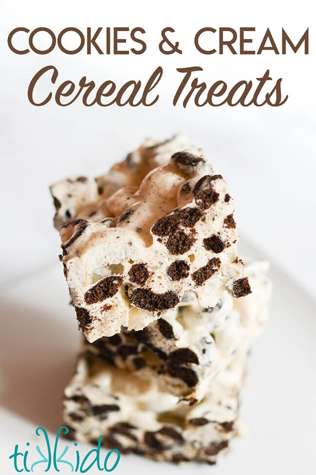 Three Cookies and Cream Oreo Cereal treats stacked on a white plate, with text overlay reading, "Cookies and Cream Cereal Treats."
