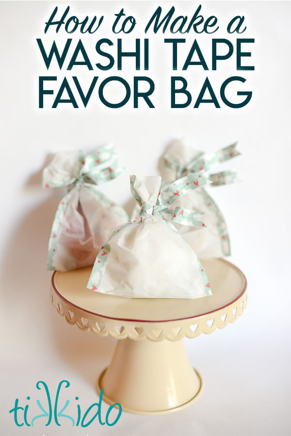 Three DIY food safe favor bags decorated with washi tape on a cream cake stand, with text overlay reading "How to Make a Washi Tape Favor Bag."