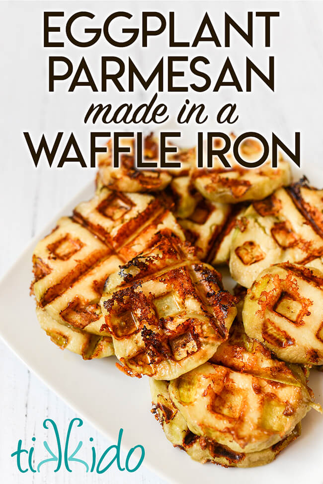 white plate stacked with healthy, gluten free eggplant parmesan slices, with text overlay reading "Eggplant Parmesan made in a Waffle Iron."