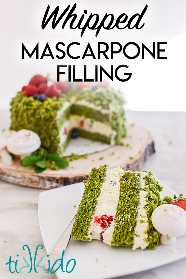 Slice of green cake on a white plate, filled with whipped mascarpone filling and fresh berries.  Text overlay reads "Whipped Mascarpone Filling."