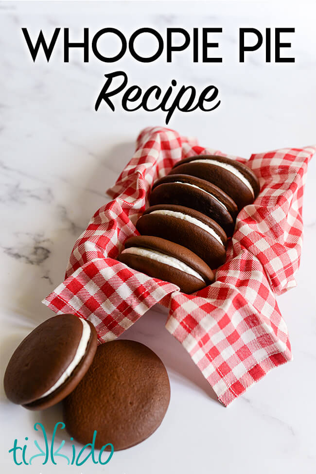 Chocolate whoopie pies in a container lined with a red and white gingham napkin, with text overlay reading "Whoopie pie recipe."