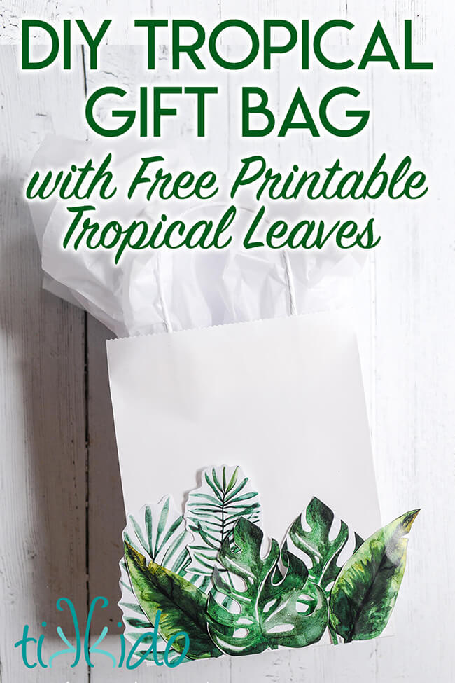 Tropical gift bag made from a plain white gift bag and printable tropical leaves.