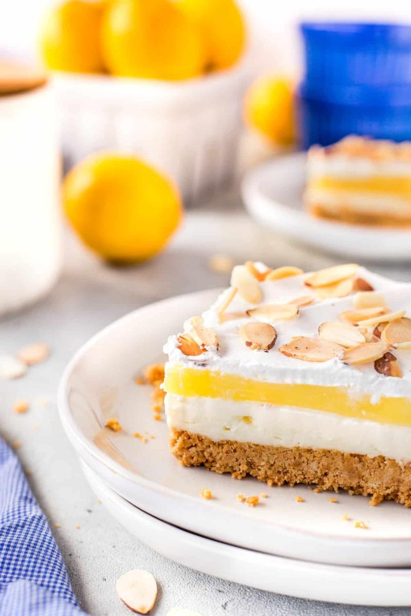 Lemon lush dessert on a white plate.