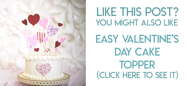 Navigational image leading reader to valentine's day paper heart cake topper tutorial.