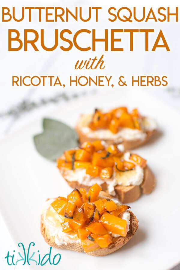 Butternut squash bruschetta with mascarpone, browned butter, and honey, on a white plate.