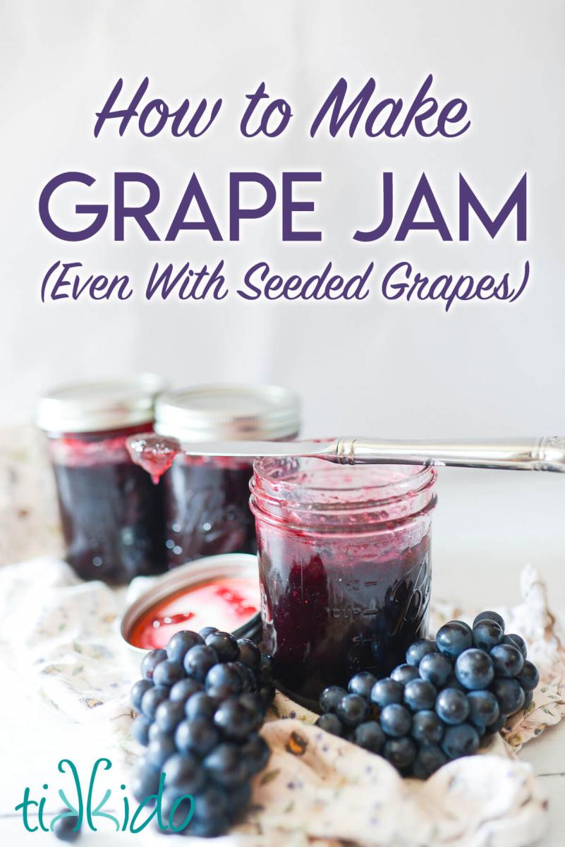 Three jars of homemade concord grape jam, one open with a knife balanced on the rim of the jar, with text overlay reading "How to make grape jam (Even with Seeded Grapes)."