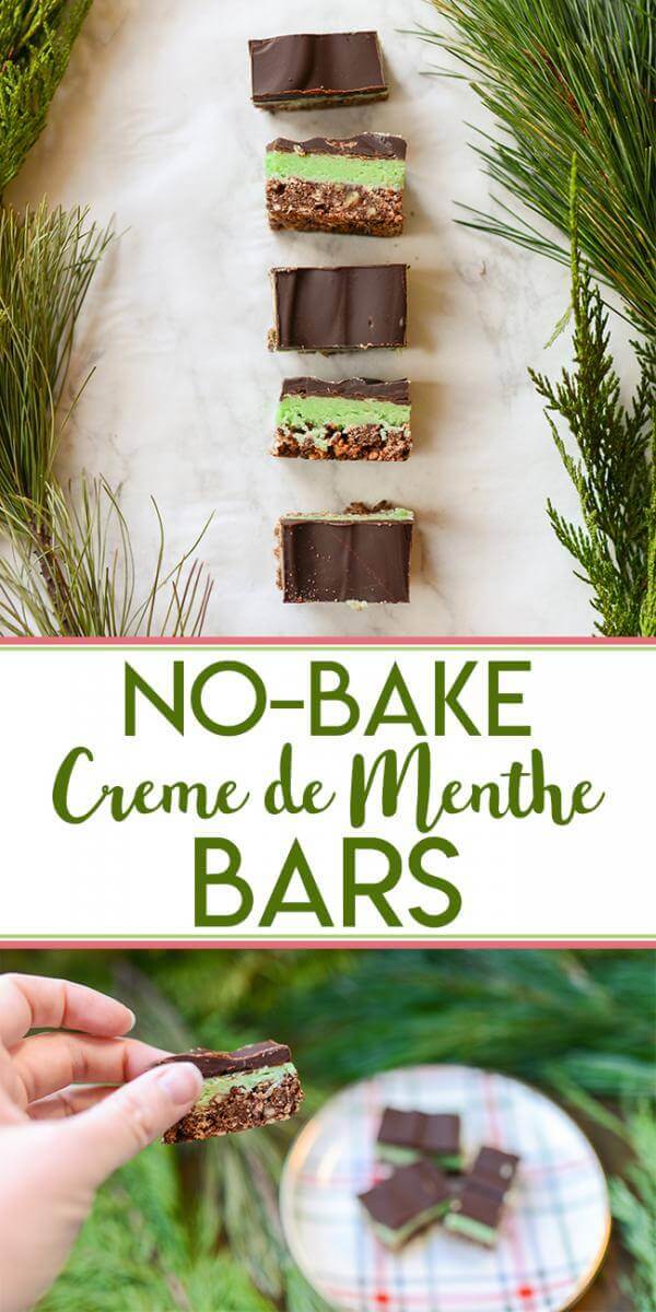 No bake, chocolate and mint creme de menthe bars on a white marble background surrounded by fresh evergreen branches.