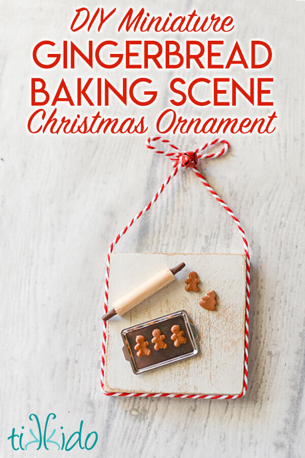 Christmas ornament that looks like a miniature baking scene with a tiny pan, rolling pin, and gingerbread cookies.