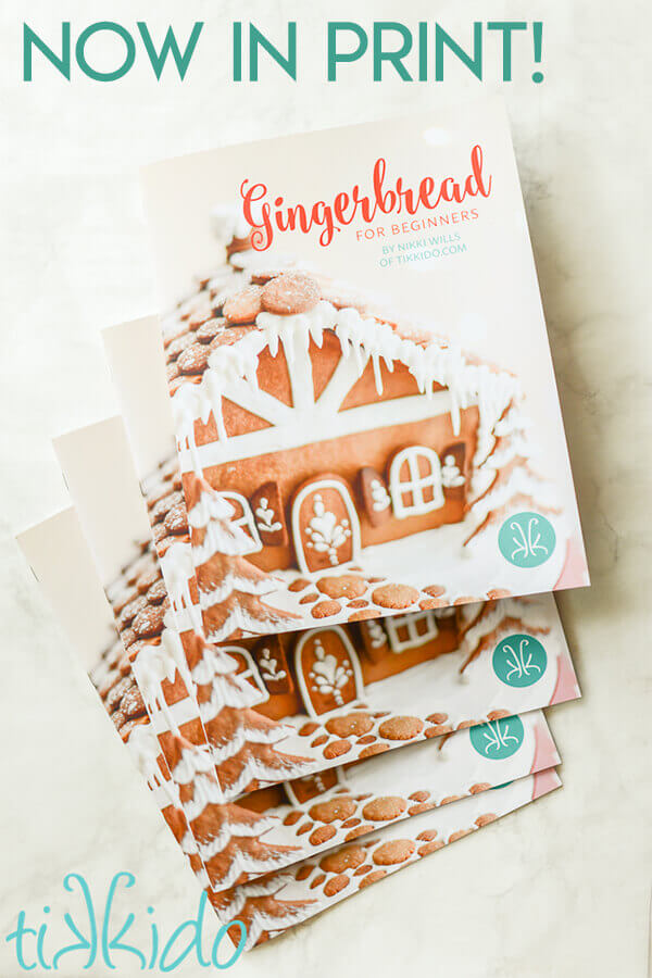 Four copies of the Gingerbread for Beginners book on a white marble background.