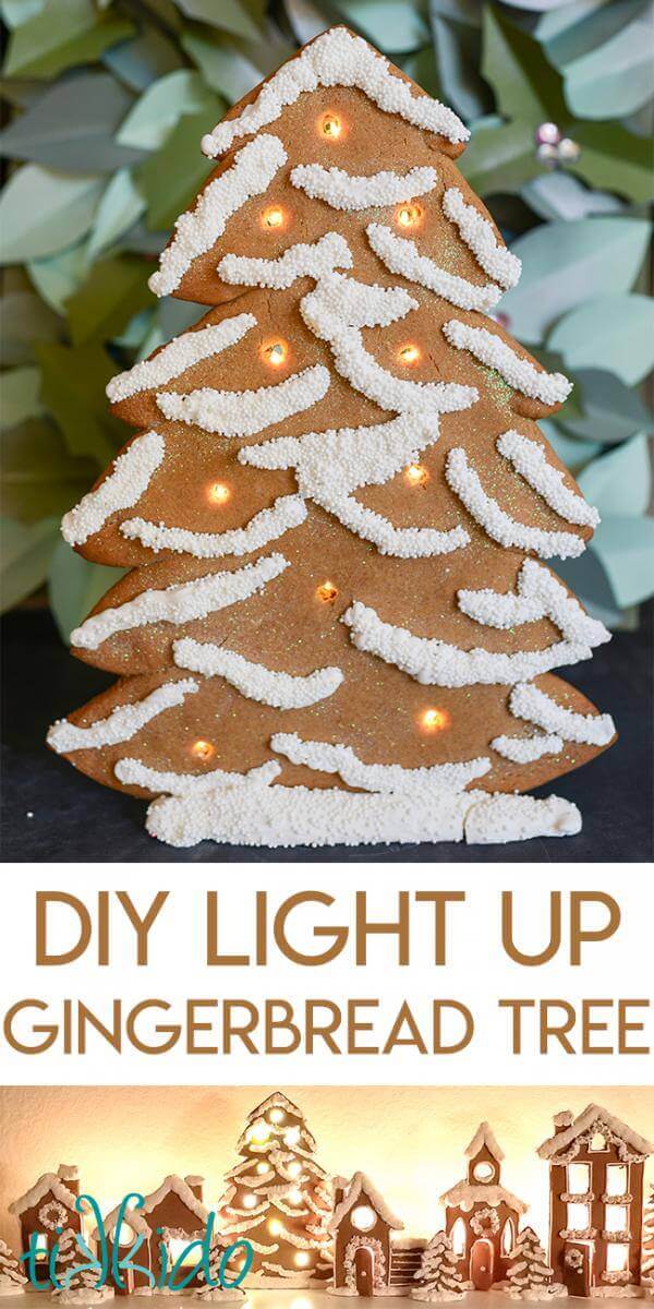 Standing gingerbread Christmas tree decorated with white royal icing and white sprinkles and lit up with LED battery operated lights.