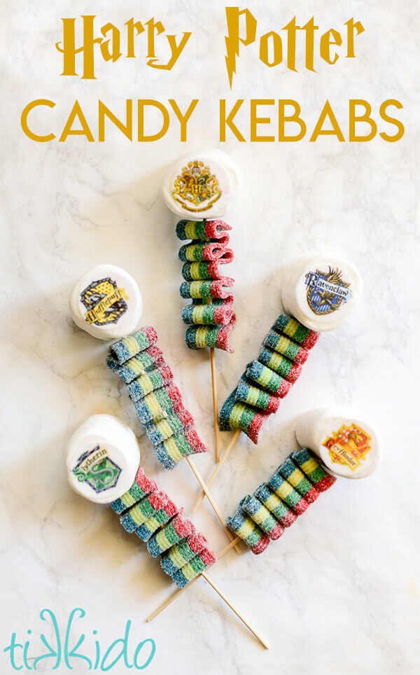 Harry Potter Candy Kebabs topped with marshmallows decorated with the Hogwarts house crests.