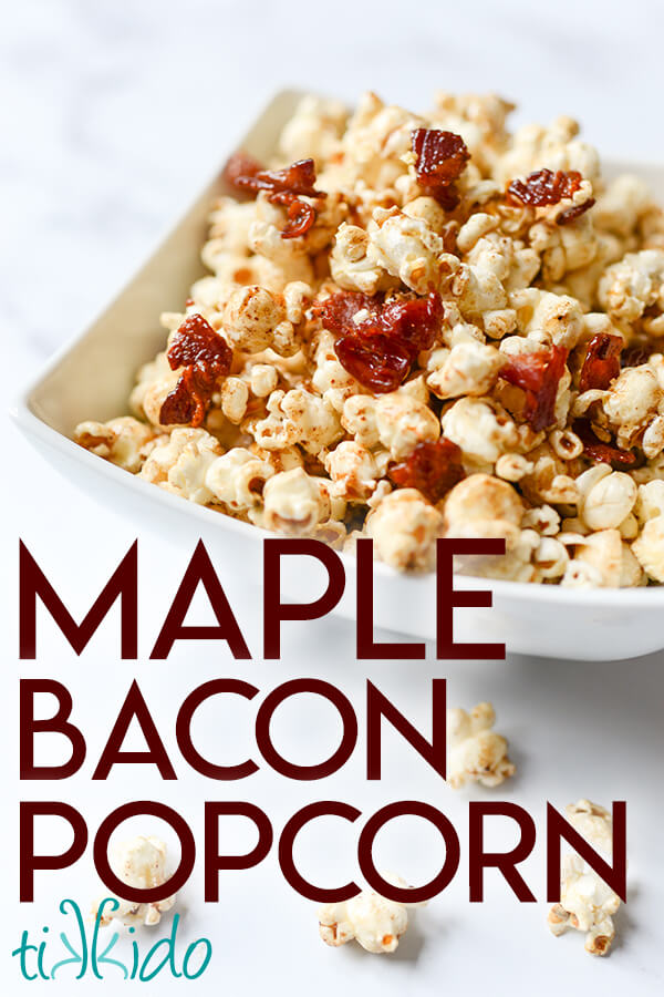 Bowl of maple bacon popcorn on a white marble table, with the text "Maple Bacon Popcorn."