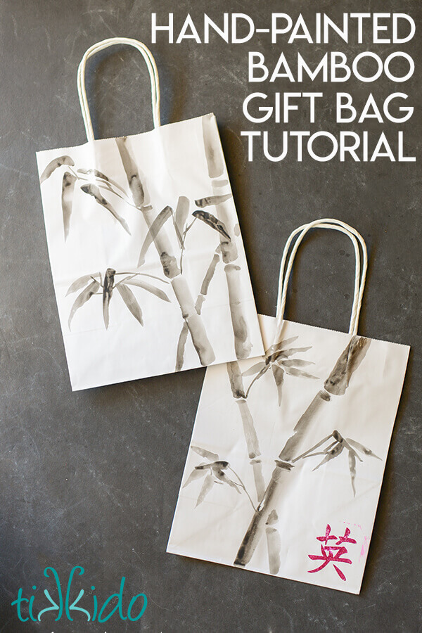 Two bamboo painted gift bags made with Japanese ink painting techniques, on a black chalkboard background.