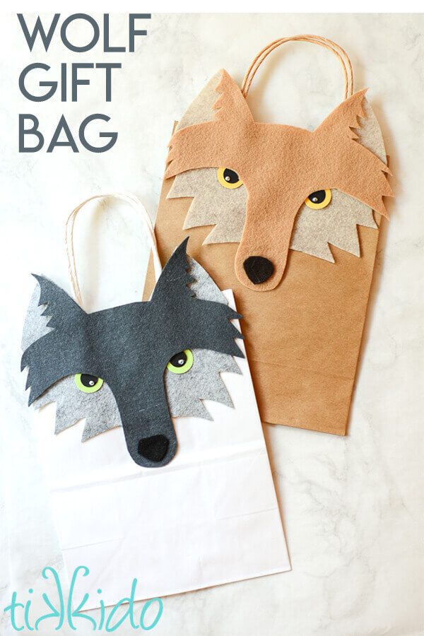 Turn a plain paper gift bag into a wolf themed gift bag with this tutorial and free printable templates.