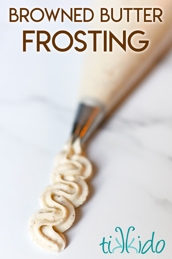Browned butter frosting piped out of an icing bag  on a marble surface, with a text overlay reading "browned butter frosting."