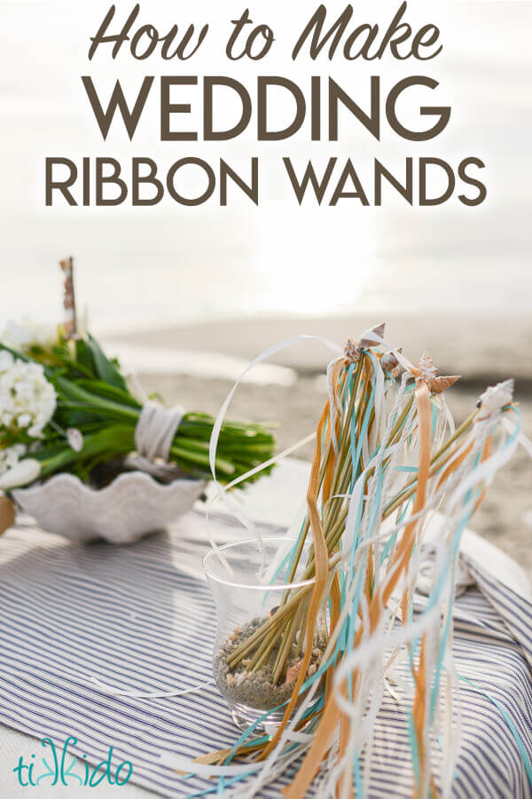 Nautical themed wedding ribbon wands on a table at the beach, with text overlay reading "How to Make Wedding Ribbon Wands."