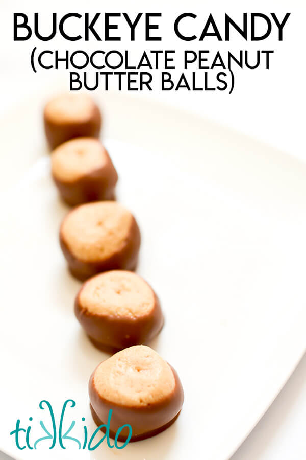 Five buckeye candies in a row on a white plate, with text overlay reading "Buckeye Candy (Chocolate peanut butter balls)."