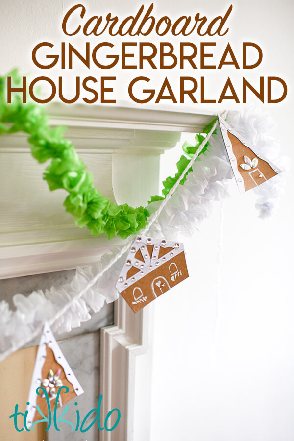 Gingerbread house DIY Christmas garland hanging on a fireplace mantel, with text overlay reading "Cardboard Gingerbread House Garland."