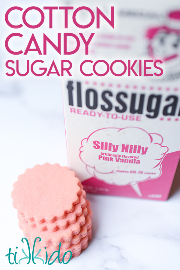 Stack of cotton candy cookies in front of a container of pink cotton candy sugar.