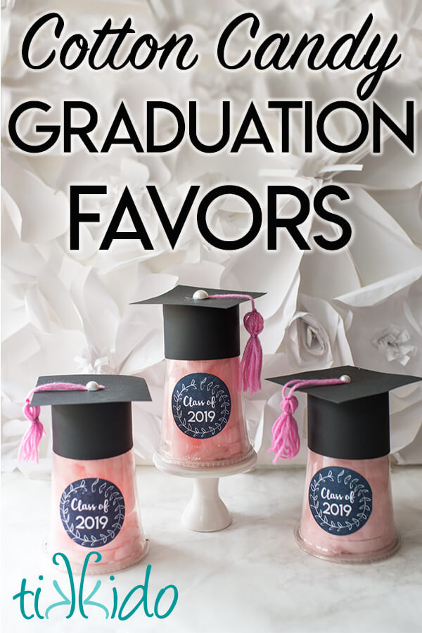 Three cotton candy filled favors for a graduation party that look like graduation caps.