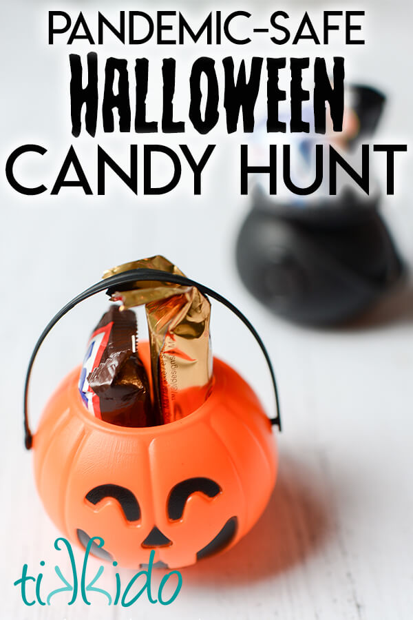 Small plastic pumpkin and cauldron filled with Halloween candy, with a text overlay reading "Pandemic safe Halloween candy hunt."