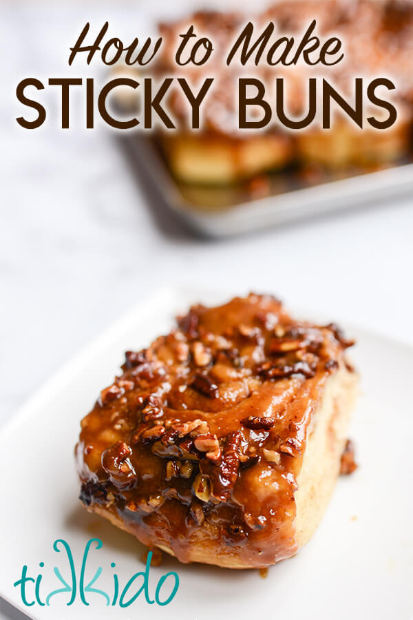 Sticky bun on a white plate in front of a tray of sticky buns, with text overlay reading "How to make sticky buns."