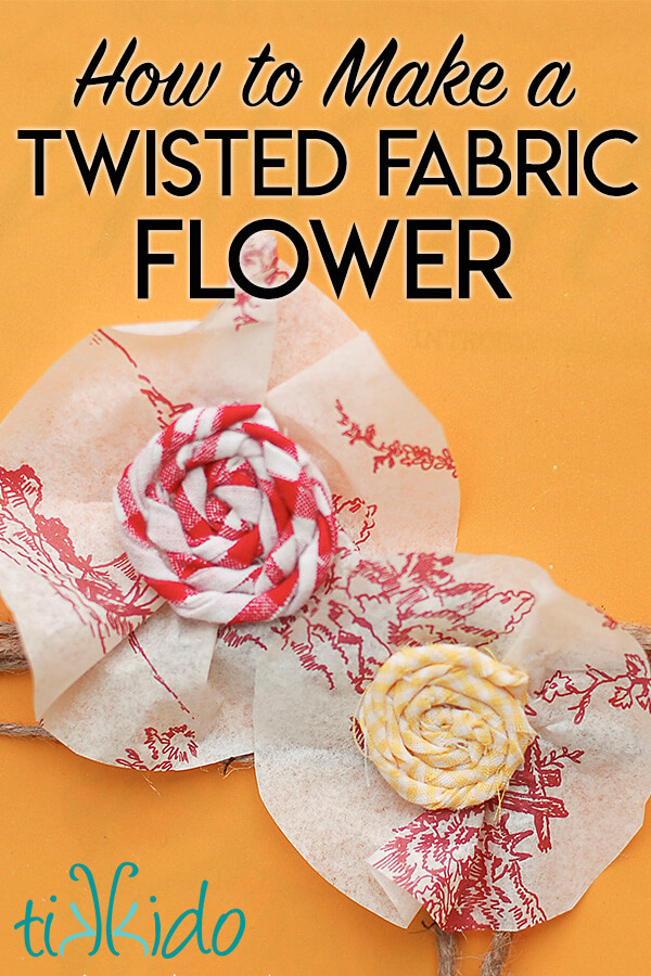 Two twisted fabric flowers made with red and yellow print fabric, on a yellow background, with text overlay reading "How to Make a Twisted Fabric Flower."