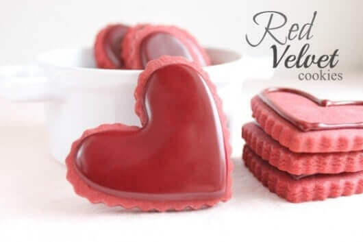 Red velvet cut out sugar cookies cut into heart shapes.