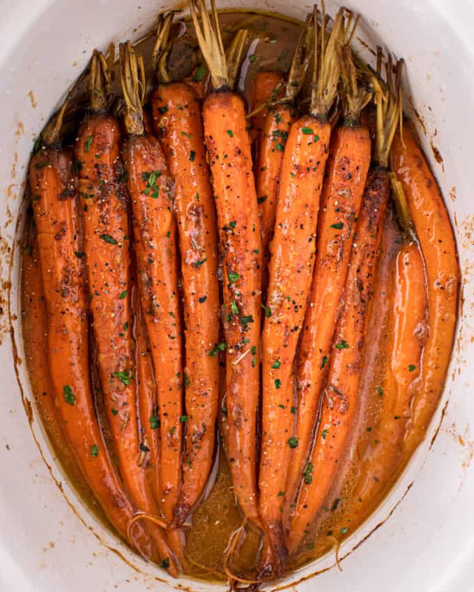 Slow cooker roasted carrots covered in a sweet and savory glaze.