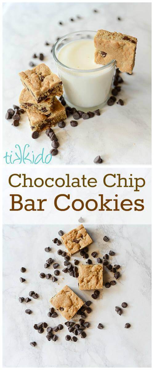 Chocolate Chip bar Cookies stacked on a white surface, next to a glass of milk with a chocolate chip cookie on the edge of the glass.