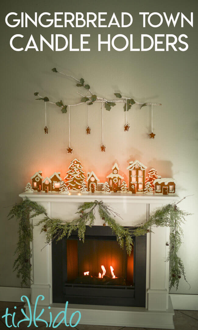 Gingerbread house candle holders decorating a fireplace mantel.