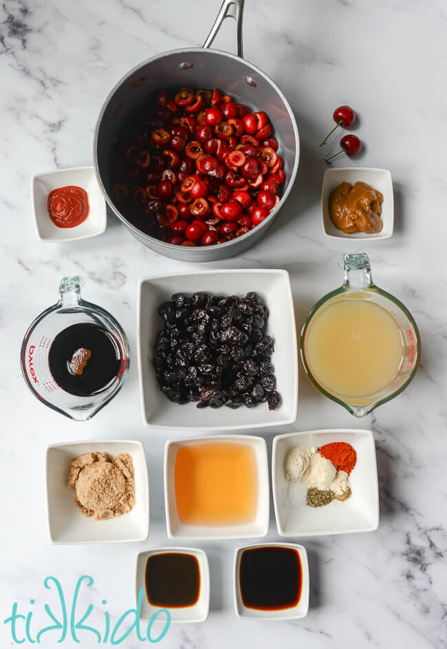 Ingredients for Cherry BBQ Sauce recipe on a white marble surface.
