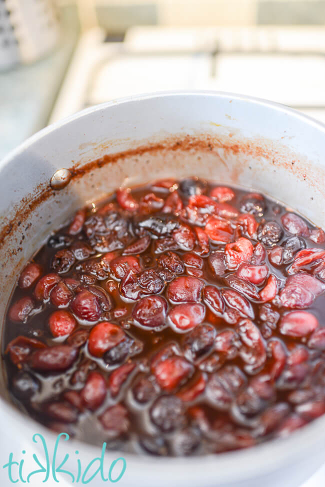 Ingredients for Cherry barbecue Sauce simmering in a saucepan.