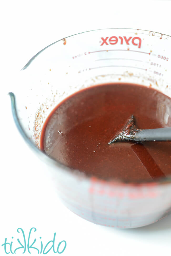 Freshly made Cherry BBQ Sauce in a large pyrex measuring cup.